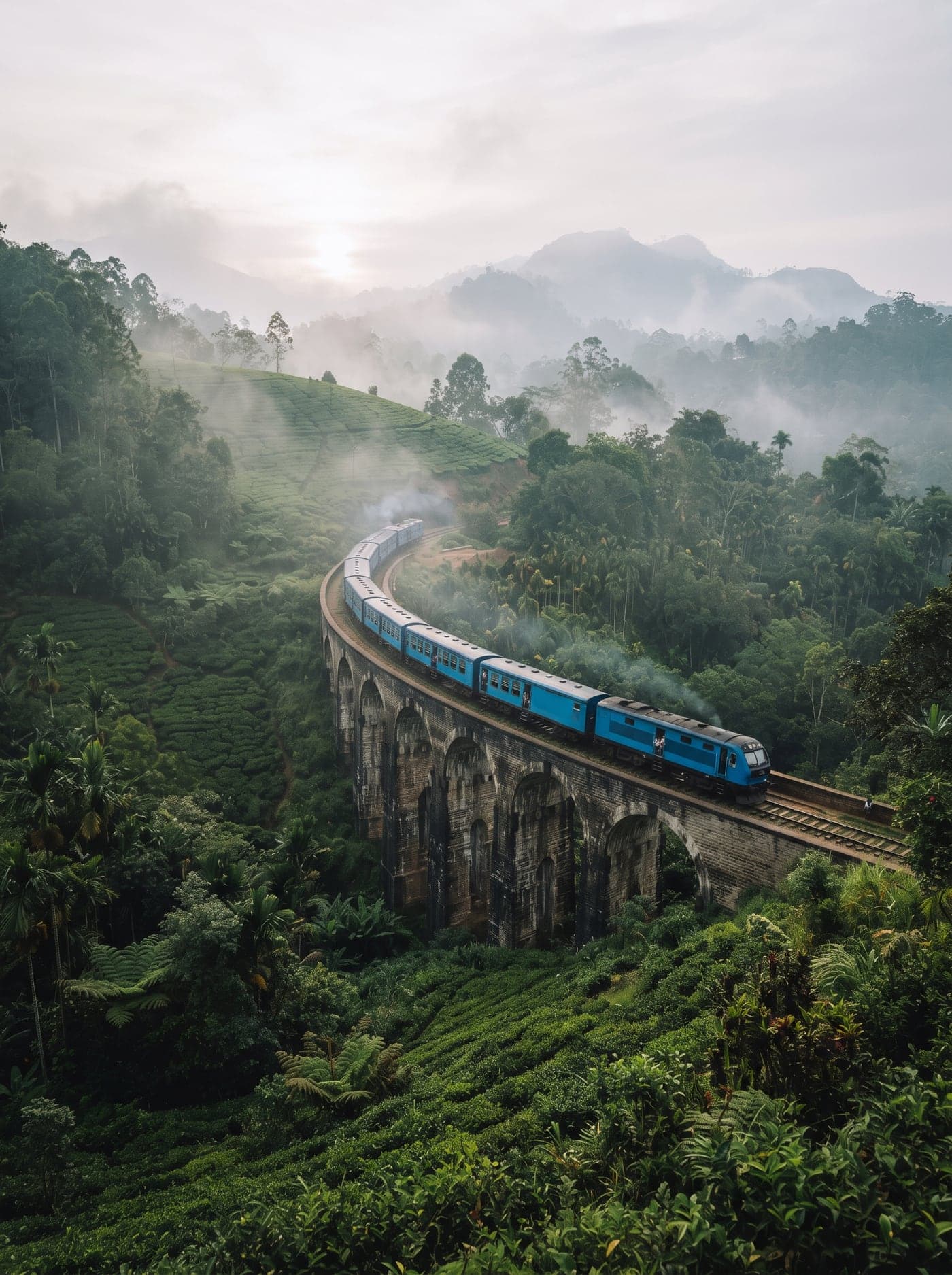 Nine Arch Bridge in Ella surrounded by lush green tea hills